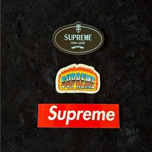 Supreme Sticker Trio in Black, Multicolor, and Red